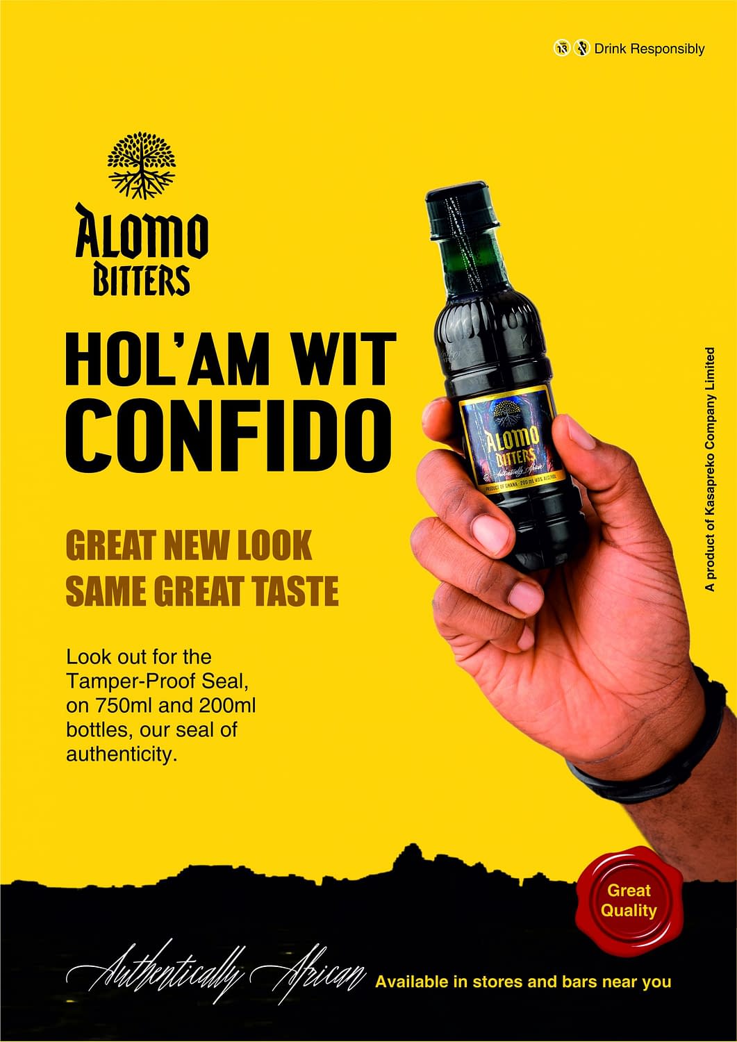 Hand holding Alomo Bitters drink
